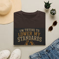T-Shirt — “I’m Trying to Lower My Standards (But Apparently They’re Load‑Bearing)” Funny Graphic Tee